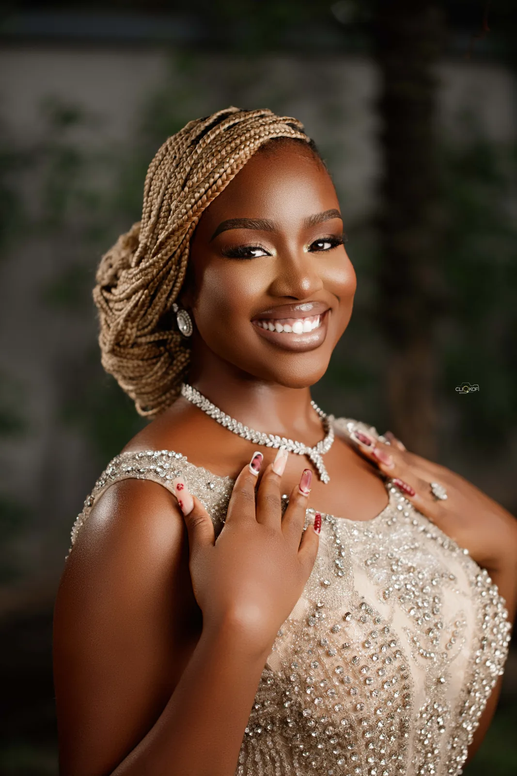 Bridal makeup with beaded headpiece
